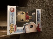 a funko pop figurine of mister rogers is in a box