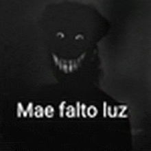 a black and white photo of a person with a smiley face and the words `` mac falto luz '' .