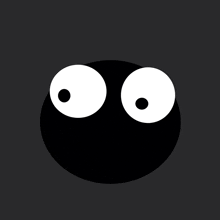 a black circle with white eyes on a dark background