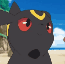 a close up of a pokemon with red eyes and a yellow crescent moon on its head .