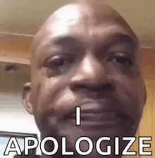 a close up of a man 's face with the words `` i apologize '' written on it .