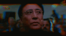 a pixelated image of a man 's face with the words 2adris written on his face