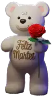 a teddy bear with the words feliz martes on its chest