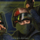 a man wearing a helmet and goggles is holding a gun with the words corewn.design written on the bottom