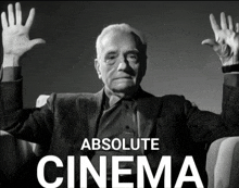 a black and white photo of a man with his hands in the air and the words absolute cinema behind him