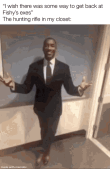 a man in a suit and tie is standing in a hallway .