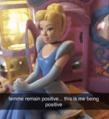 a cinderella figurine with a caption that says " lemme remain positive "