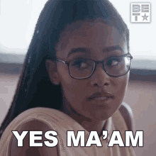 a woman wearing glasses says " yes ma am "