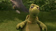 a cartoon turtle is looking at the camera with a tree in the background