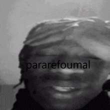 a black and white photo of a person 's face with the words pararefoumal written on it