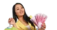 a woman in a yellow jacket is holding a bunch of money