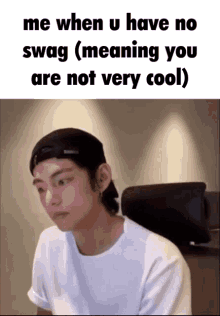 a man wearing a hat and a white shirt says me when u have no swag ( meaning you are not very cool)