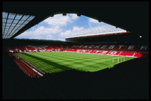 a view of a manchester united soccer stadium from the stands