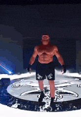 a man in boxing shorts is standing in a circle