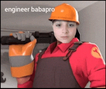 a man in a hard hat and overalls is holding a drill and a glove .