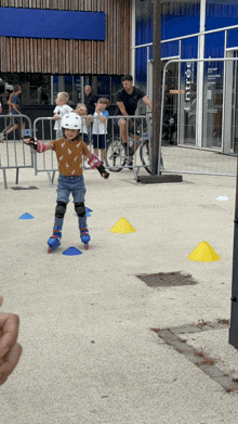 a young girl rollerblading in front of a building that says entree