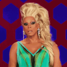 drag queen rupaul wearing a blue and green dress