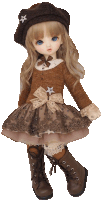 a doll wearing a brown dress and a brown hat with a star on it