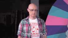 a bald man wearing glasses and a shirt that says southpaw regional