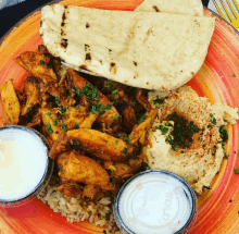 a plate of food with a plastic container that says solo