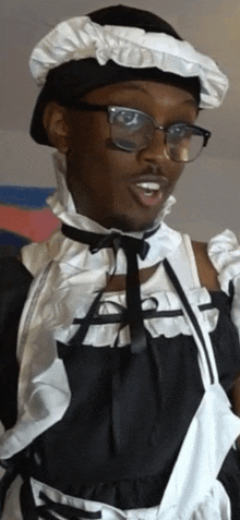 a man dressed as a maid wearing glasses