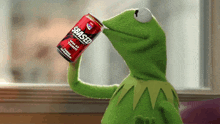 kermit the frog is drinking a can of sbased