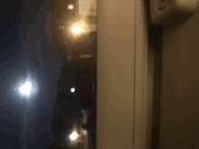 a blurred image of a window with a light shining through it