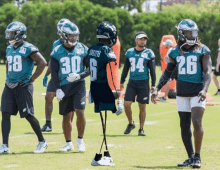 a group of philadelphia eagles football players are standing on the field