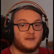 a man with glasses and headphones on his head