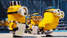 a group of minions standing next to each other with a drawing of a banana on a piece of paper