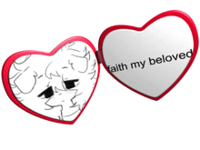 a heart shaped mirror with the words " faith my beloved " on it