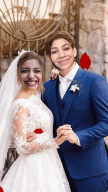 a bride and groom pose for a picture with their faces drawn on