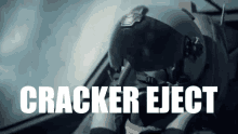 a man wearing a helmet with the words cracker eject written on it