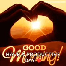 a good morning greeting card with two hands making a heart shape with the sun in the background .