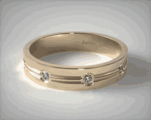 a yellow gold james allen ring with diamonds on it