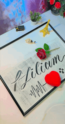 a framed piece of paper with the name lilium written on it