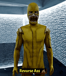 a man in a yellow superhero costume is standing in front of a wall with a sign that says reverse ass