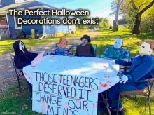 a group of halloween decorations are sitting around a table with a sign that says those teenagers deserved it change our minds