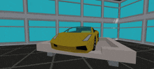 a yellow sports car sits on a table in a room with lots of windows