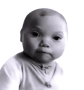 a black and white photo of a baby making a face