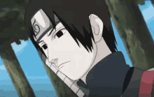 a close up of a naruto character with a headband on his head .