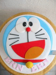 a cake with doraemon on it and the name ern on it