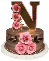 a cake with pink roses and a letter n