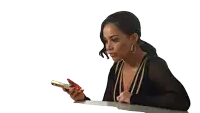 a woman with red nails is looking at a cell phone