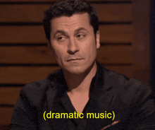 a man with dramatic music written on the bottom of his face