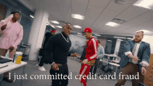 a group of men are dancing in an office with the words i just committed credit card fraud