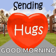 a red heart with the words `` sending hugs '' and `` good morning '' written on it .