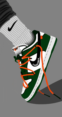 a person wearing a pair of green and white nike sneakers with orange laces .