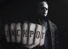 a man holds up his fist with the word jackpot on it