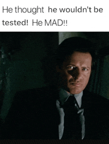 a man in a suit and tie says he thought he wouldn 't be tested